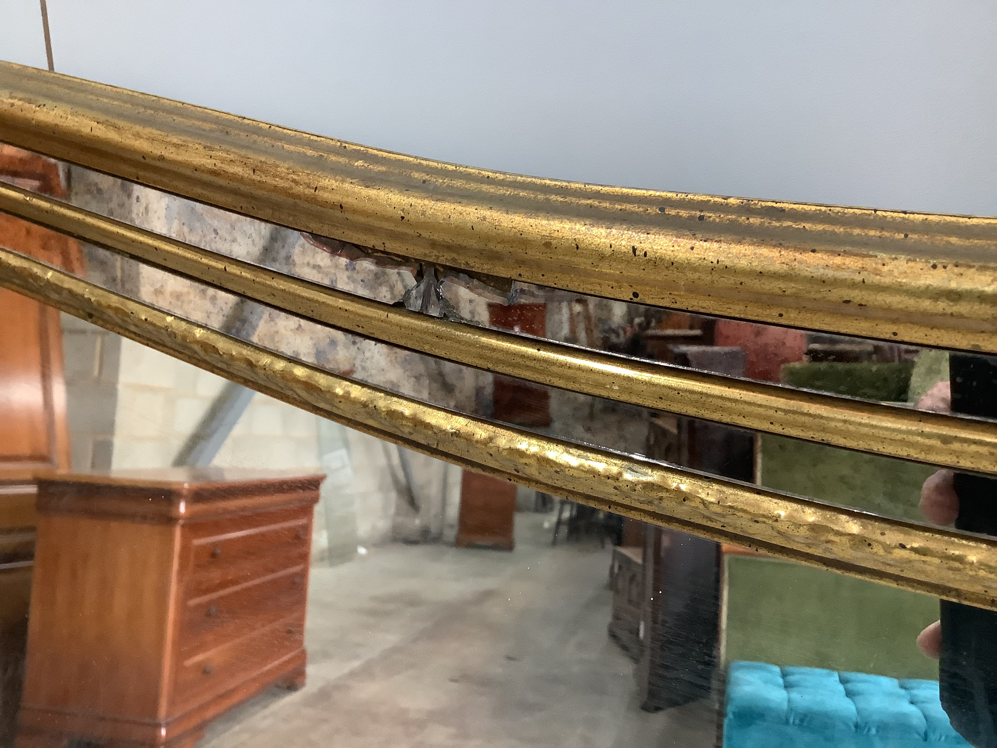 A large Victorian style gilt framed overmantel mirror, width 184cm, height 112cm